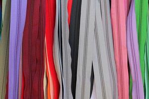 Detailed close up view on samples of cloth and fabrics in different colors found at a fabrics market photo