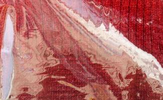 Detailed close up view on samples of cloth and fabrics in different colors found at a fabrics market photo