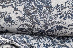Detailed close up view on samples of cloth and fabrics in different colors found at a fabrics market photo