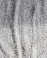 Detailed close up view on samples of cloth and fabrics in different colors found at a fabrics market photo