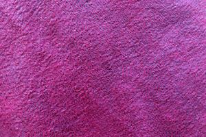 Detailed close up view on samples of cloth and fabrics in different colors found at a fabrics market photo