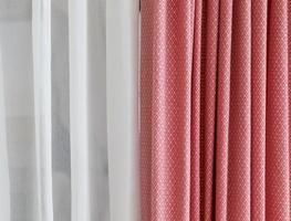 Detailed close up view on samples of cloth and fabrics in different colors found at a fabrics market photo