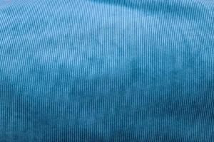 Detailed close up view on samples of cloth and fabrics in different colors found at a fabrics market photo