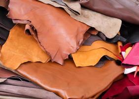 Detailed close up view on samples of cloth and fabrics in different colors found at a fabrics market photo