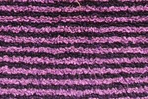 Detailed close up view on samples of cloth and fabrics in different colors found at a fabrics market photo