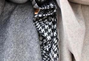 Detailed close up view on samples of cloth and fabrics in different colors found at a fabrics market photo