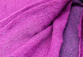 Detailed close up view on samples of cloth and fabrics in different colors found at a fabrics market photo