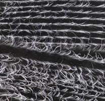 Detailed close up view on samples of cloth and fabrics in different colors found at a fabrics market photo