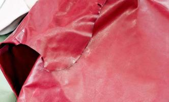 Detailed close up view on samples of cloth and fabrics in different colors found at a fabrics market photo
