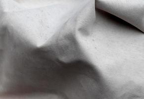 Detailed close up view on samples of cloth and fabrics in different colors found at a fabrics market photo