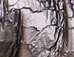 Detailed close up view on samples of cloth and fabrics in different colors found at a fabrics market photo
