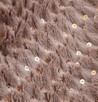 Detailed close up view on samples of cloth and fabrics in different colors found at a fabrics market photo