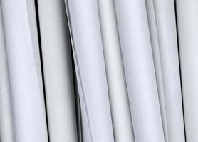 Detailed close up view on samples of cloth and fabrics in different colors found at a fabrics market photo