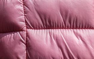 Detailed close up view on samples of cloth and fabrics in different colors found at a fabrics market photo