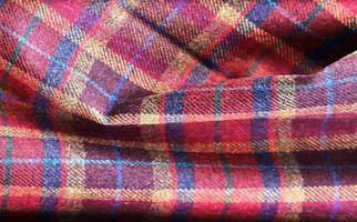 Detailed close up view on samples of cloth and fabrics in different colors found at a fabrics market photo