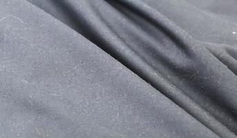 Detailed close up view on samples of cloth and fabrics in different colors found at a fabrics market photo