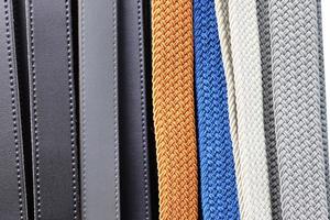Detailed close up view on samples of cloth and fabrics in different colors found at a fabrics market photo
