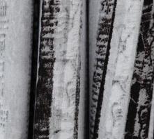 Detailed close up view on samples of cloth and fabrics in different colors found at a fabrics market photo