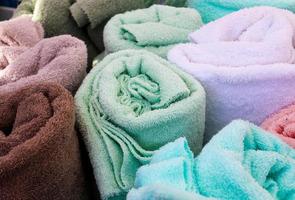 Detailed close up view on samples of cloth and fabrics in different colors found at a fabrics market photo