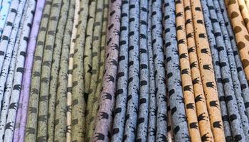 Detailed close up view on samples of cloth and fabrics in different colors found at a fabrics market photo