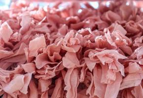 Detailed close up view on samples of cloth and fabrics in different colors found at a fabrics market photo