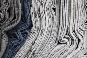 Detailed close up view on samples of cloth and fabrics in different colors found at a fabrics market photo