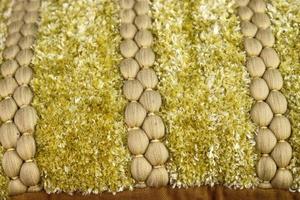 Detailed close up view on samples of cloth and fabrics in different colors found at a fabrics market photo