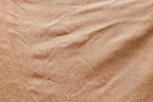 Detailed close up view on samples of cloth and fabrics in different colors found at a fabrics market photo