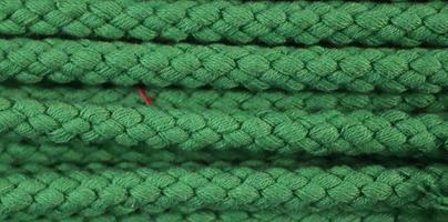 Detailed close up view on samples of cloth and fabrics in different colors found at a fabrics market photo