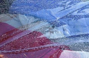 Detailed close up view on samples of cloth and fabrics in different colors found at a fabrics market photo