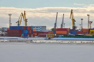 Harbor cranes, container ship terminal, cargo container yard photo