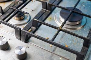 Dirty stove top with oil splatters, fat stains and food leftovers photo