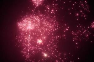 Pink red night fireworks bright sparkles and shiny festival explosion, glittering motion of sky fire photo