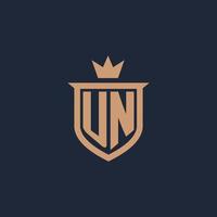 UN monogram initial logo with shield and crown style vector