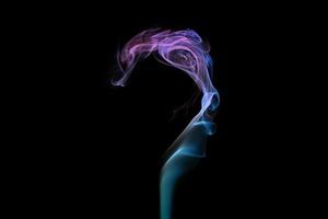 Multicolored smoke question mark shape on black background, mysterious swirled smoke clouds photo