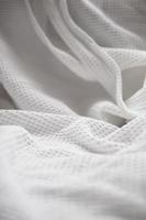 The white fabric texture pattern background. photo