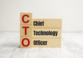 CTO character. Chief Technology Officer. Chief Technology Officer. Written on three wooden blocks. photo