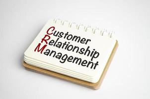 notepad with the text CRM Customer Relationship Management photo