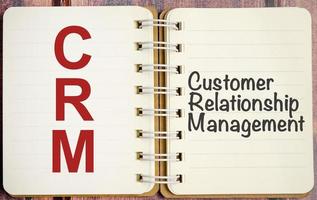 notepad with the text CRM Customer Relationship Management photo