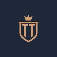 logotipo inicial del monograma tt con estilo de escudo y corona vector