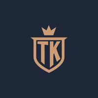 logotipo inicial del monograma tk con estilo de escudo y corona vector