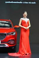 Nonthaburi, Thailand - DEC 3, 2019 Unidentified model poses with a car at The 36th Motor Expo Thailand 2019 at IMPACT Arena, Muang Thong Thani, Nonthaburi, Thailand. photo