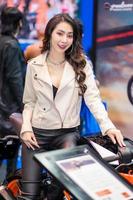 Nonthaburi, Thailand - MAR 27, 2021 Unidentified model poses with a car at The 42th Bangkok International Motor Show Thailand 2021 at IMPACT Arena photo