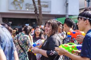 Siam Square, Bangkok, Thailand - APR 13, 2019 short action of people joins celebrations of the Thai New Year or Songkran in Siam Square. photo