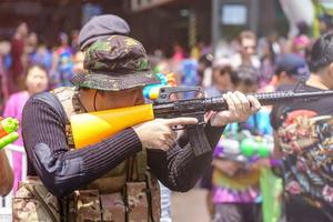 Siam Square, Bangkok, Thailand - APR 13, 2019 short action of people joins celebrations of the Thai New Year or Songkran in Siam Square. photo