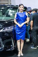 Nonthaburi, Thailand - MAR 27, 2021 Unidentified model poses with a car at The 42th Bangkok International Motor Show Thailand 2021 at IMPACT Arena photo