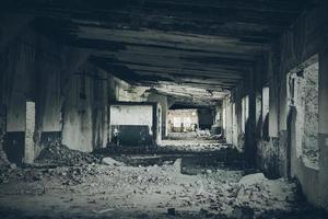 Abandoned building interior, ruins of industrial factory, spooky scary dark corridor, horror scene photo