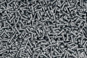 Bunch of galvanized stainless bolts with button head, hardware background, silver screws photo