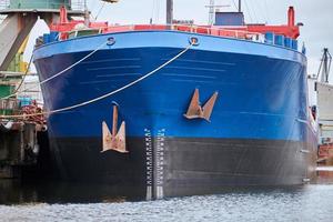 Bow of large cargo ship in port, close up photo