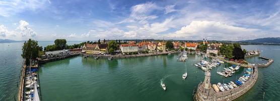 Amazing panorama of Harbor on Lake Constance with a statue of a lion at the entrance in Lindau, Bavaria, Germany. photo